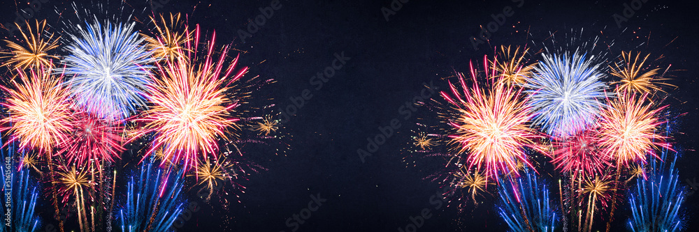 Fireworks pyrotechnics celebration party event festival holiday or New Year background panorama - Colorful firework on dark night sky..