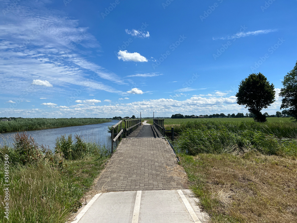 Bicycle path next to a canal around Basse