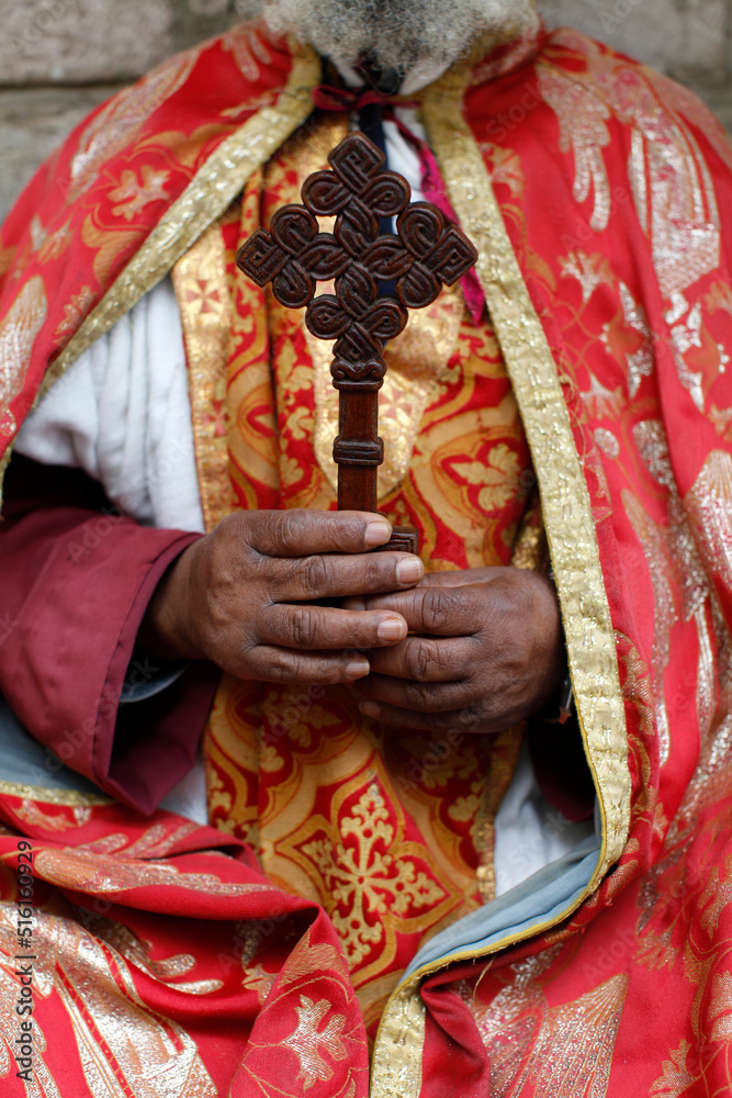 Coptic orthodox priest holding a cross