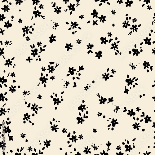 Simple vintage pattern. Small black flowers  leaves and dots. Light beige background. Fashionable print for textiles and wallpaper.