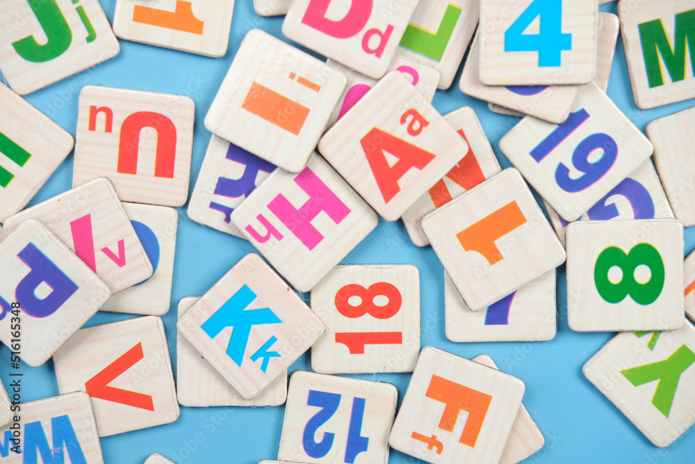 colorful plastic letters on white background, close up colorful plastic letters on white background, close up