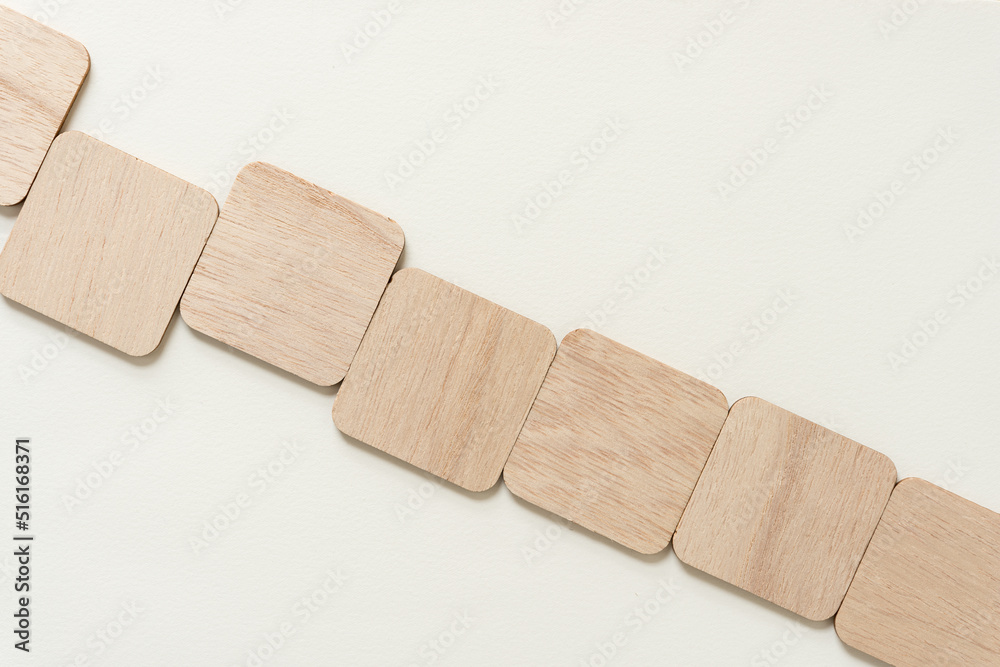 Obraz premium set of wooden squares with rounded corners on paper