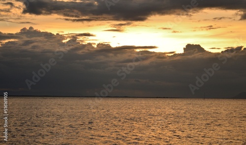 Black storm clouds obscuring the sun in the middle of the sea Concept Meteorological Department Weather Forecast Monsoon season Tourism Holiday Check the weather before departure