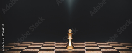 King chess stand on chessboard concept of challenge or team player or business team and leadership strategy or strategic planning and human resources organization risk management.