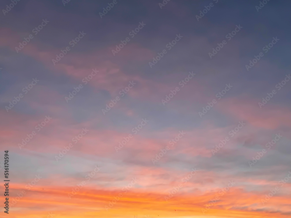 Sunset sky with colorful clouds background concept. Evening sunset in the city. Empty beautiful red and orange sky view twilight time of Istanbul, Turkey.