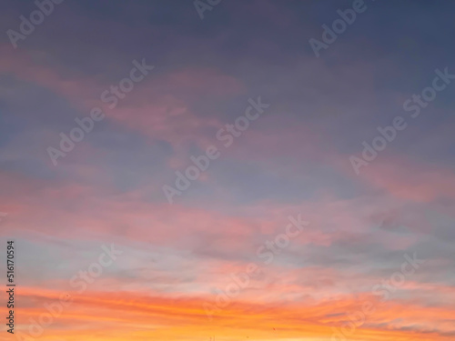 Sunset sky with colorful clouds background concept. Evening sunset in the city. Empty beautiful red and orange sky view twilight time of Istanbul, Turkey.
