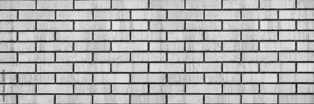 Fototapeta premium Brick wall background. The texture of smooth brickwork. Creative background for art.