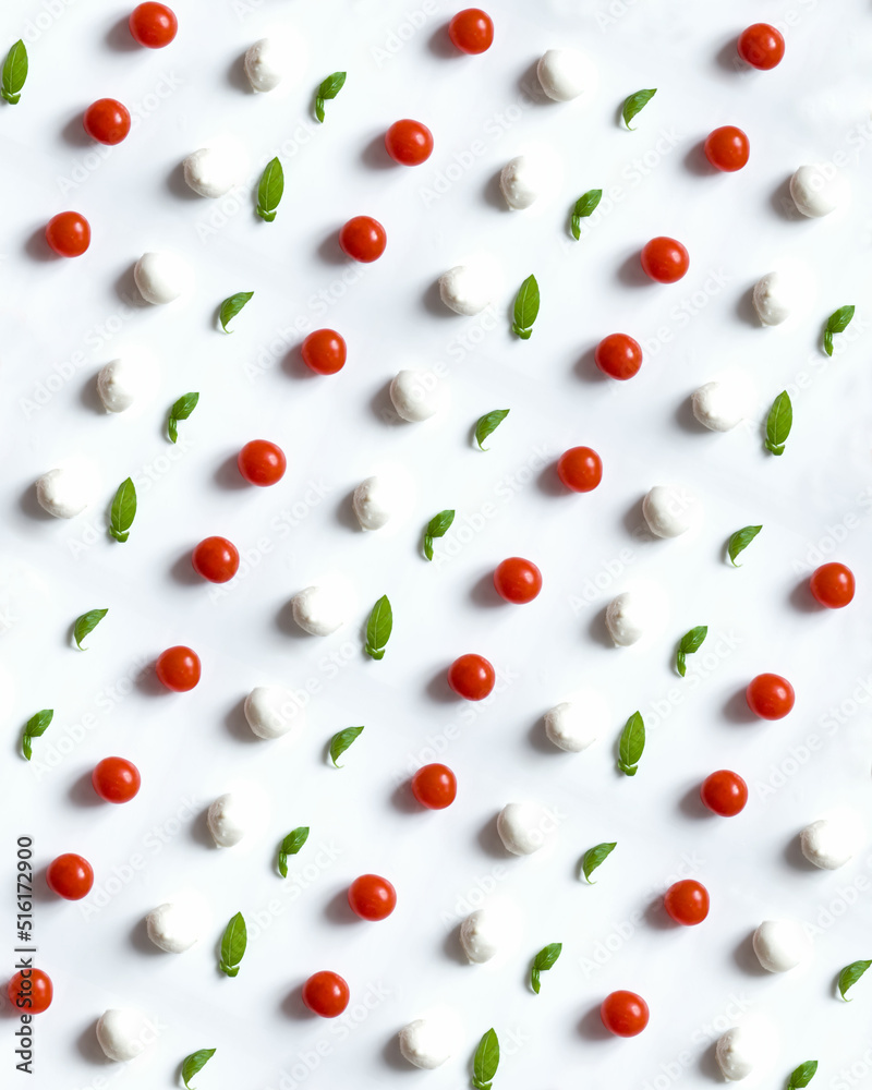Pattern from tomatoes, basil and mozzarella on white background Pattern from tomatoes, basil and mozzarella on white background