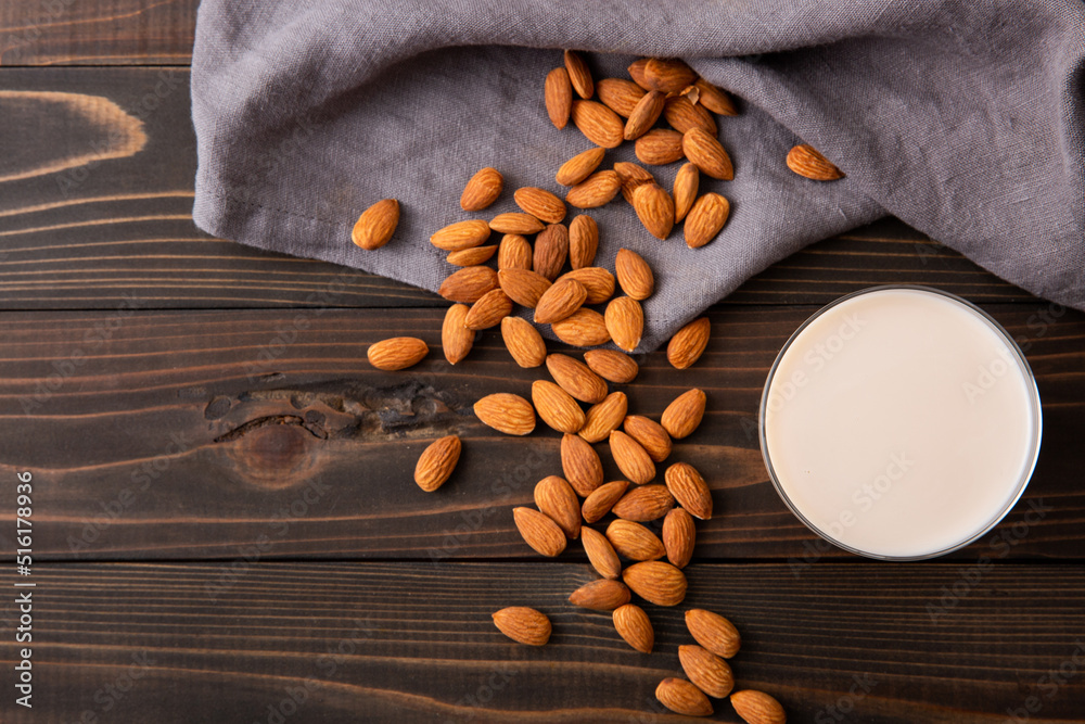 Almond and almond milk on wooden table Almond and almond milk on wooden table
