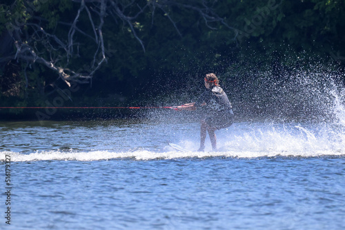 Waterskiier bouncing on water making huge waves © Janet