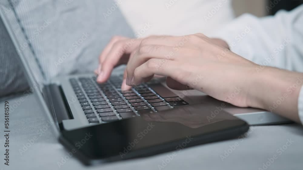 Female hands of business woman professional user worker using typing on laptop notebook keyboard sit at home on sofa working online with pc software apps technology concept, close up side view