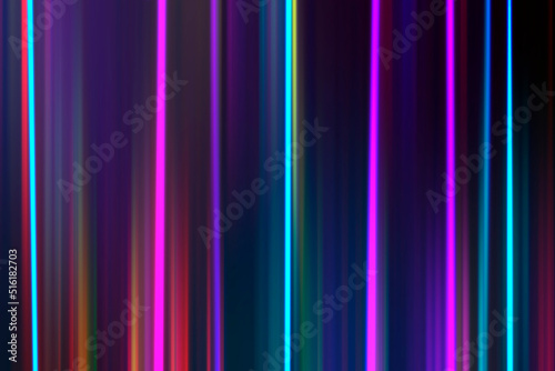 Abstract night background, blurred bokeh light. Multi colored neon lights on dark city street, reflection of neon light. Night view.