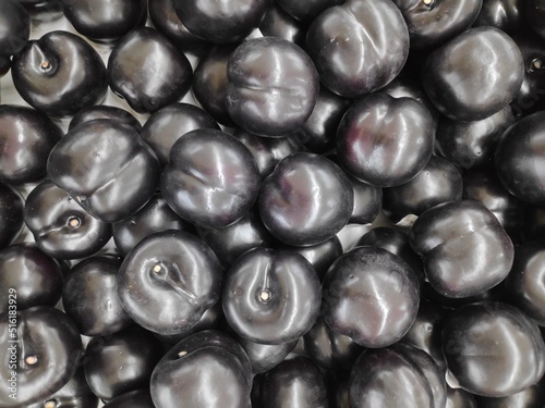 A bunch of fresh and healthy black plums
