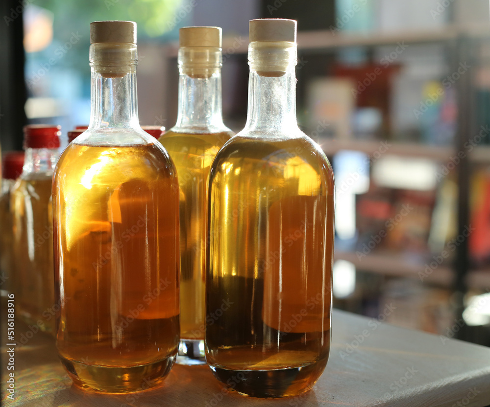 glass bottles with oil on the table glass bottles with oil on the table