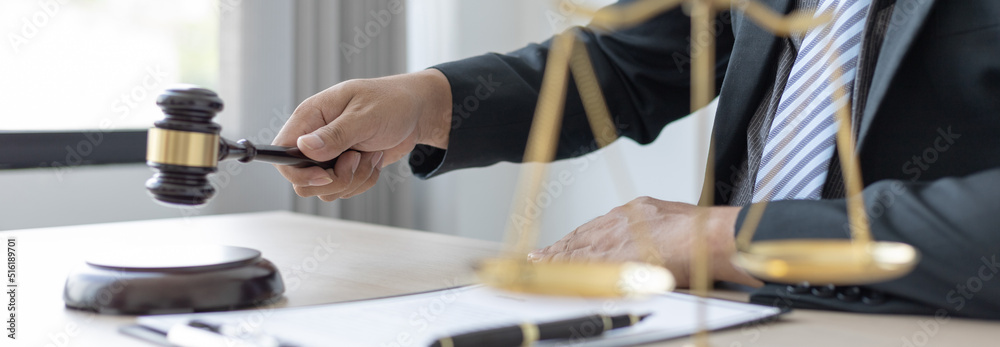 Lawyer or judge holding Hammer prepares to judge the case with justice, Legal consulting services and  litigation, scales of justice, law hammer, Concept of litigation and legal services