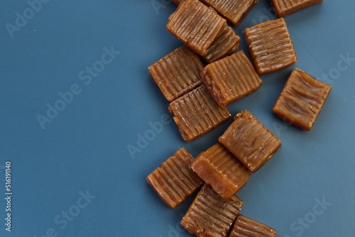 caramel candies on a blue background