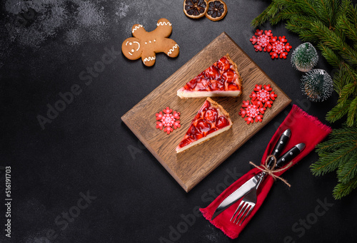Delicious christmas strawberry tart on concrete background, top view, copy space