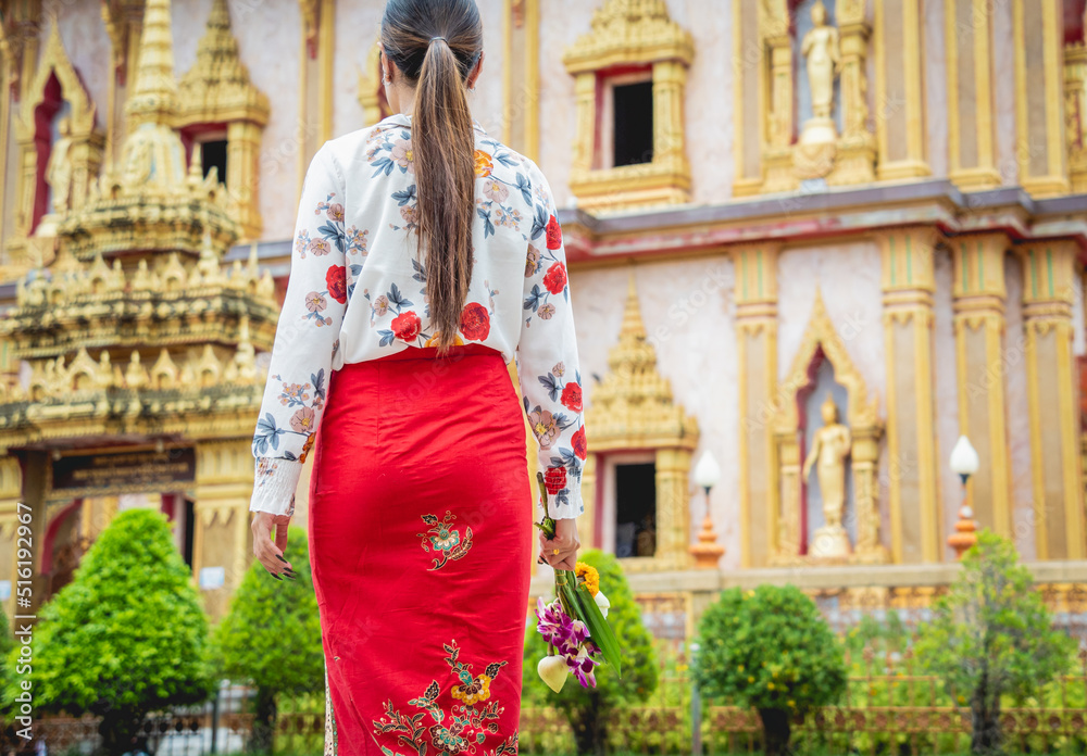 Beautiful Asian girl at big Buddhist temple dressed in traditional costume Beautiful Asian girl at big Buddhist temple dressed in traditional costume