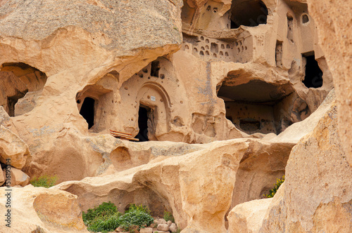 From below close-up shot of cave dwellings of Cappadocia, Goreme National Park of Nevsehir, Turkey. Cave house architectures of Cappadocia.