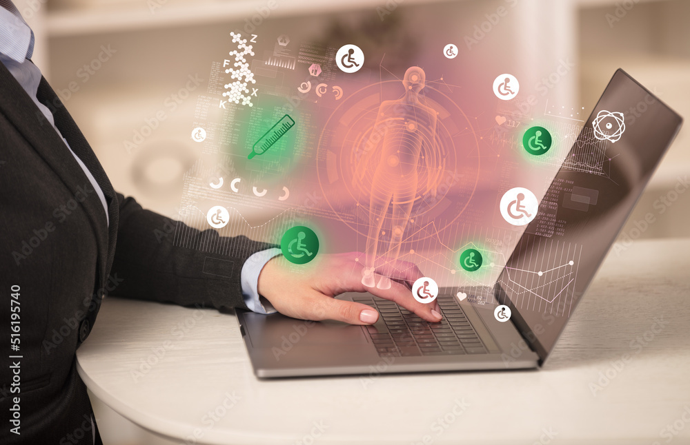 Doctor working on laptop with healthcare concept Doctor working on laptop with healthcare concept