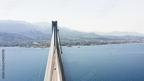 Aerial drone shot of cable strayed bridge over sea also known as Charilaos Trikoupis Rio - Antirio bridge which connects Greece mainland with Peloponnese. photo