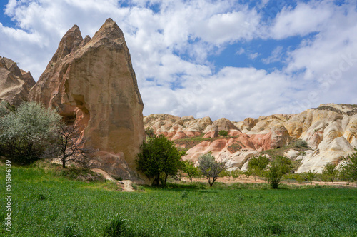 Beautiful landscape of Mustafapasa village, fairy chimneys, hills, cave dwellings trees and nature of Cappadocia in summer time, Urgup, Nevsehir, Turkey.