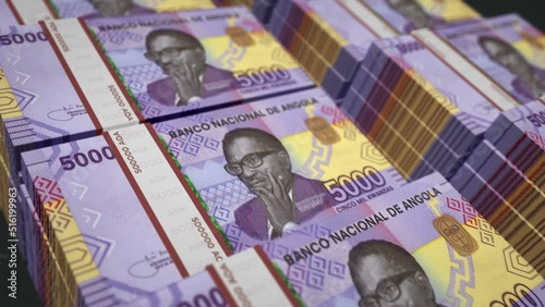 Angolan Kwanza money pack loop 3d animation. Loopable seamless concept of finance, cash, economy, business and bank in Angola. Camera moving over the 5000 AOA banknote bundle stacks. photo