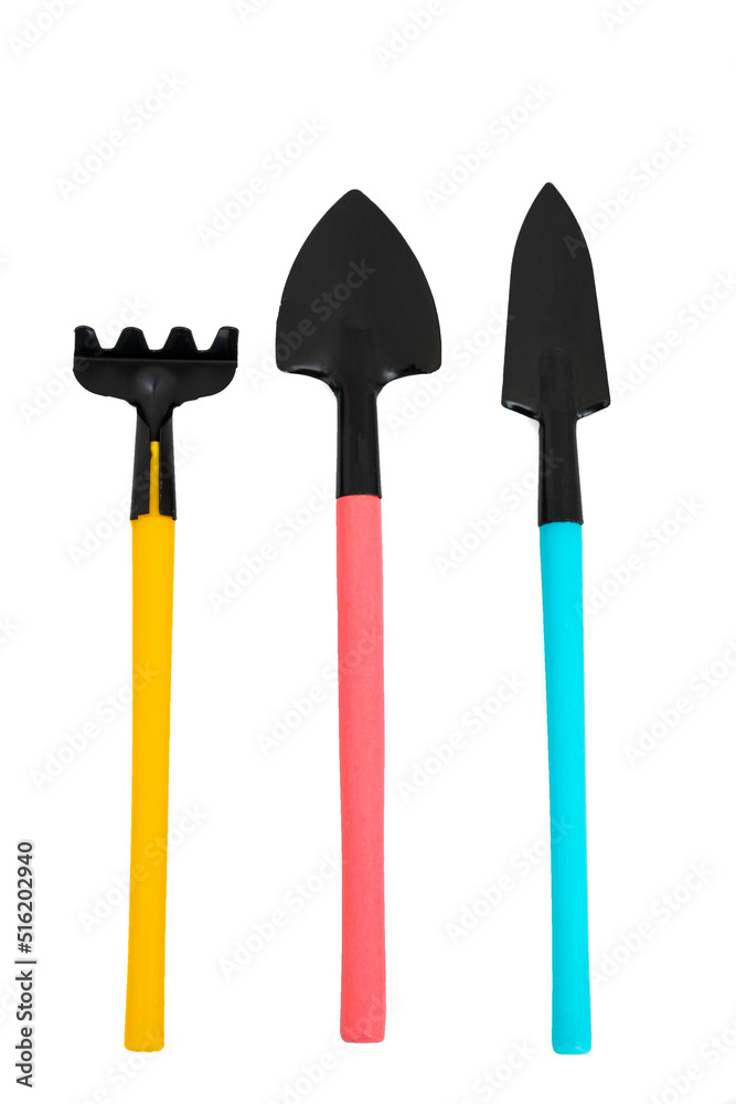 Miniature colorful gardening tools set on white background Miniature colorful gardening tools set on white background