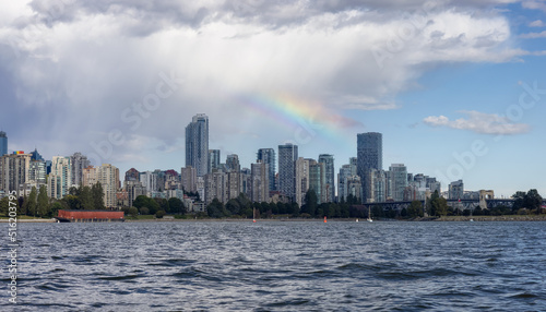 Downtown Vancouver City Skyline with clouds and rainbow. False Creek  British Columbia  Canada. Modern Cityscape on West Coast of Pacific Ocean.