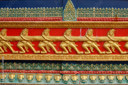 Wat Hawari sculpture detail : scene from the Ramayana : churning of the sea of milk