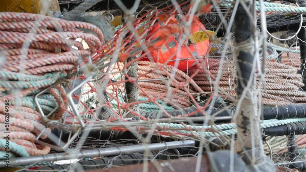 Traps, ropes and cages on pier, commercial dock, fishing industry ...