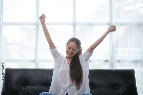 Beautiful young business women are stretching and relaxing while woking on paperworks with chart. © aksonsat