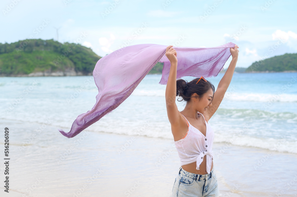 Young Beautiful woman enjoying and relaxing on the beach,  Summer, vacation, holidays, Lifestyles concept.