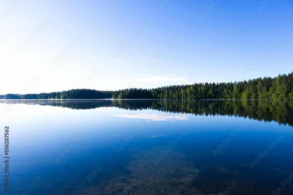 Beautiful lake with forest. Summer season landscape background. Travel in Finland concept. Beautiful places in Finland.