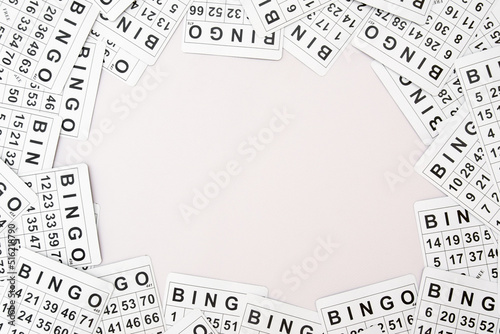 A lot of cards for a board game of bingo or lotto on a light background.