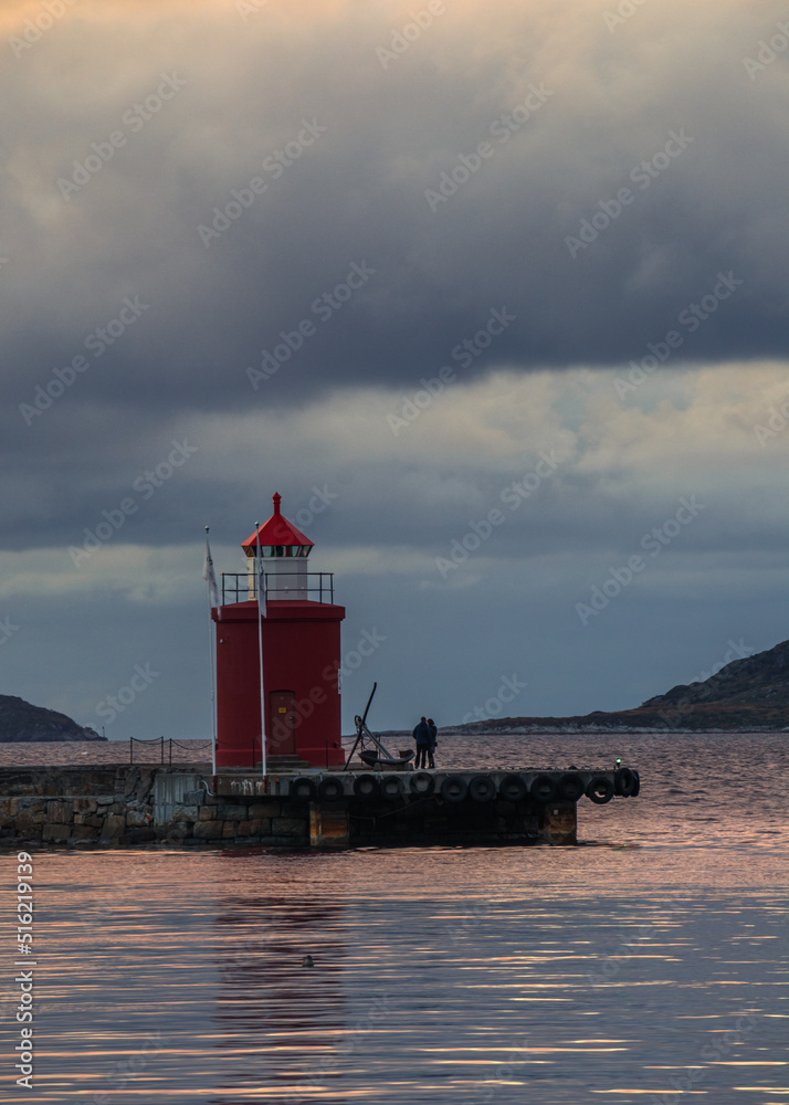 lighthouse on the shore of the sea