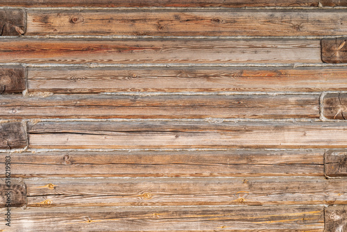 Wooden texture of the log house wall, background.
