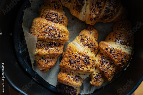 Homemade chocolate croissants with chocolate sprinkles baked in air fryer at home © manuta