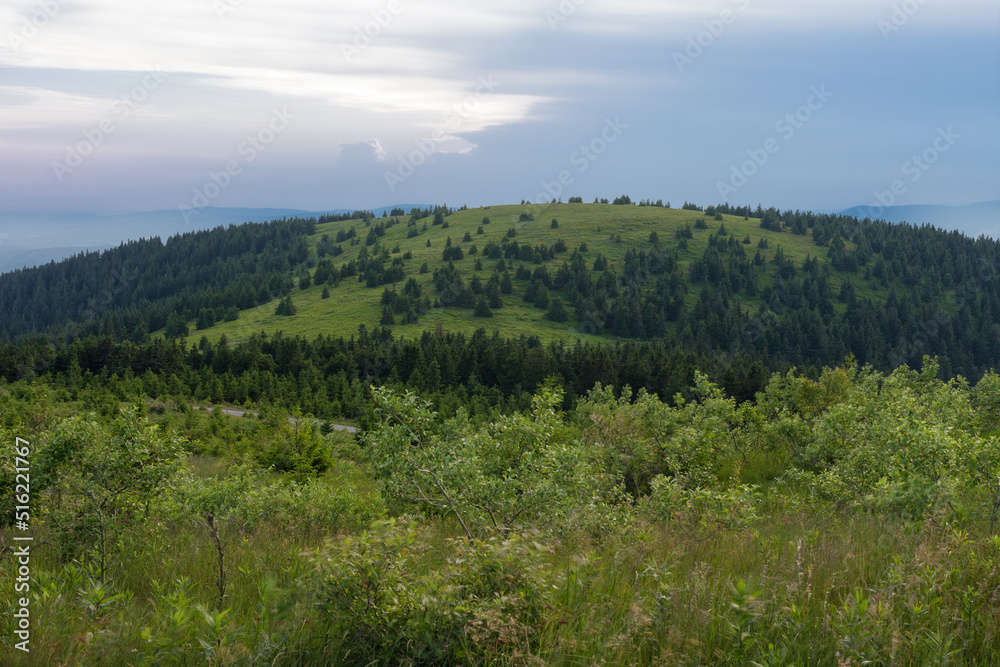 Obraz premium Mravenecnik hill , view from upper water reservoir of the pumped storage hydro power plant Dlouhe Strane in Jeseniky Mountains, Czech Republic. Summer sunset evening. 