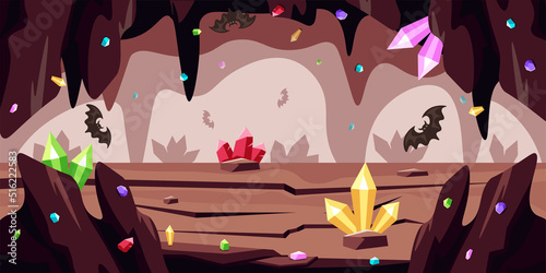 Vector illustration of a beautiful cave. Cartoon cave landscape with gems, bats, stalagmites.