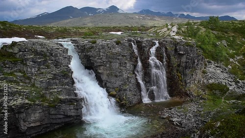 Waterfall in impressive Norwegian landscape, nature and travel scene photo
