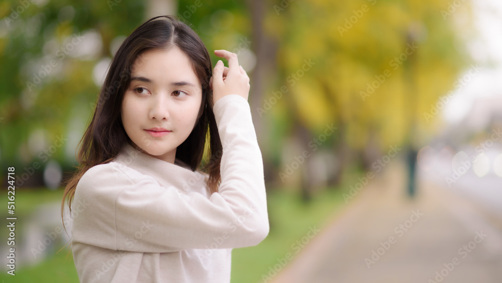 portrait cheerful smiling asian woman with blooming golden shower flower portrait cheerful smiling asian woman with blooming golden shower flower