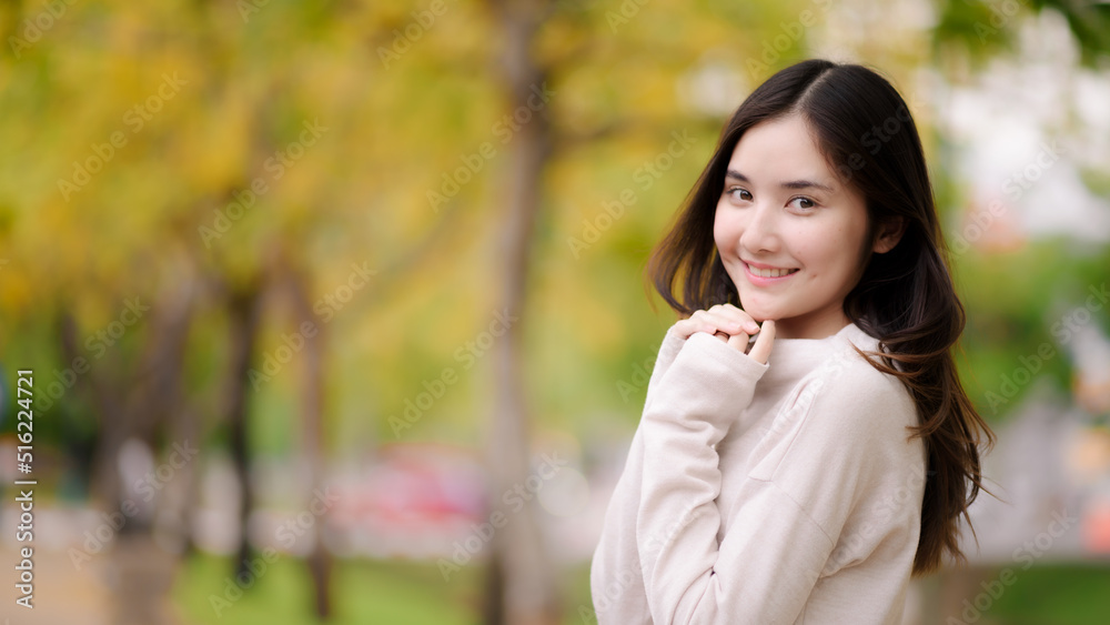 portrait cheerful smiling asian woman with blooming golden shower flower portrait cheerful smiling asian woman with blooming golden shower flower