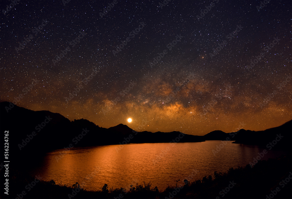 Beautiful landscape mountains and lake in the night with Milky Way with Mars and brightest Venus background, Chiang mai, Thailand