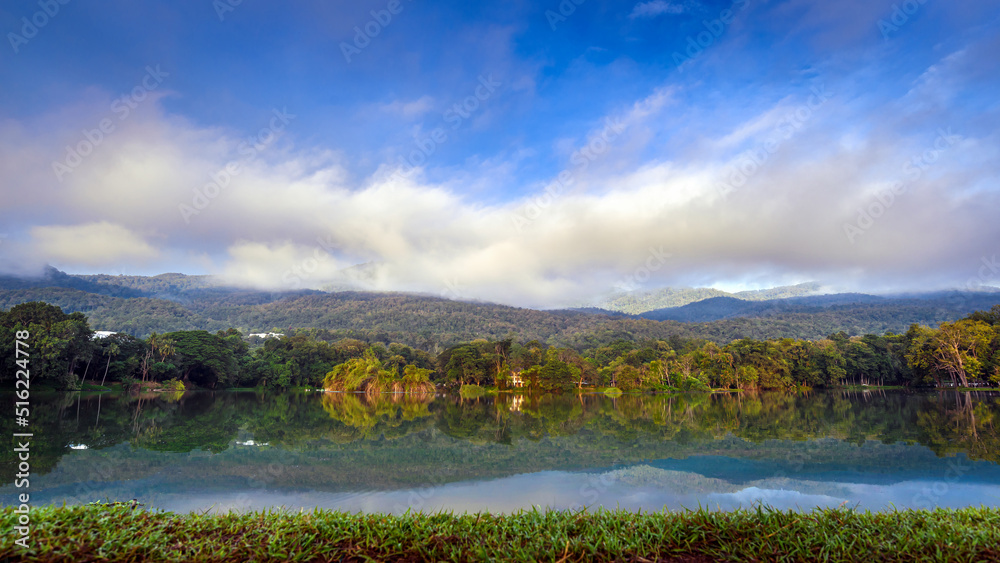 Ang Kaew lake landscape with mountains background in winter season at morning , Chiang mai , Thailand