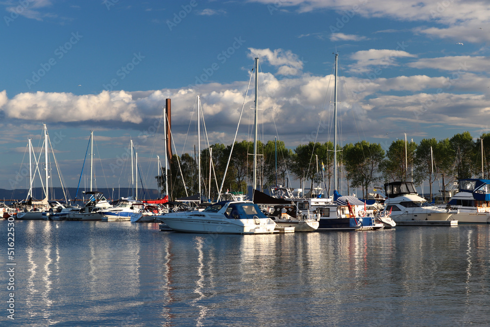 Beautiful reflections of the evening sun in Superior waters - Thunder Bay Marina, Ontario, Canada