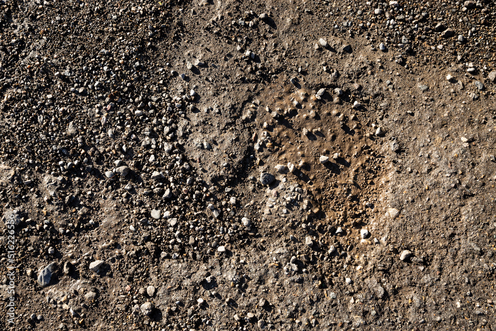 detail of a gravel road background detail of a gravel road background