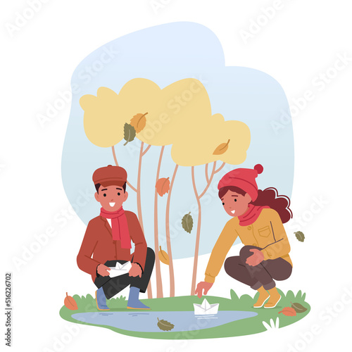 Little Kids Playing on Street with Paper Boat Floating in Puddle at Autumn Weather. Children Outdoor Activities, Fun