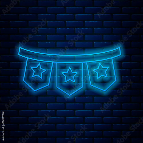 Glowing neon line Carnival garland with flags icon isolated on brick wall background. Party pennants for birthday celebration, festival decoration. Vector