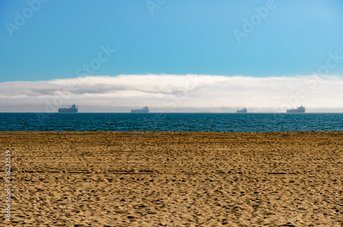 Cargo ships anchored of the California coast in Long Beach